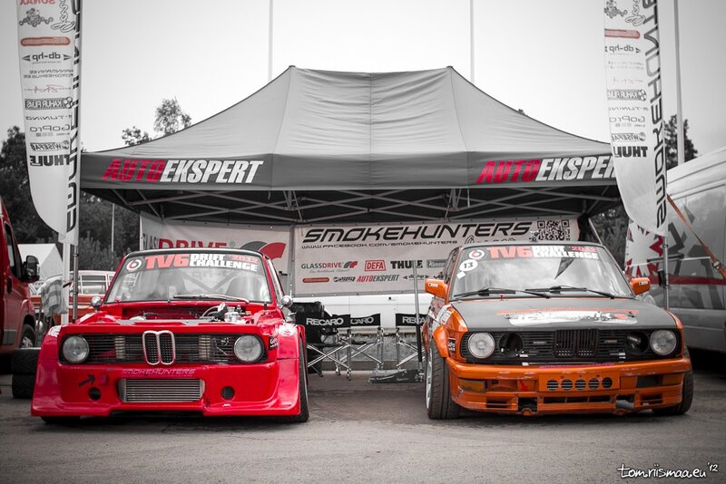 Two race cars at a motorsport event