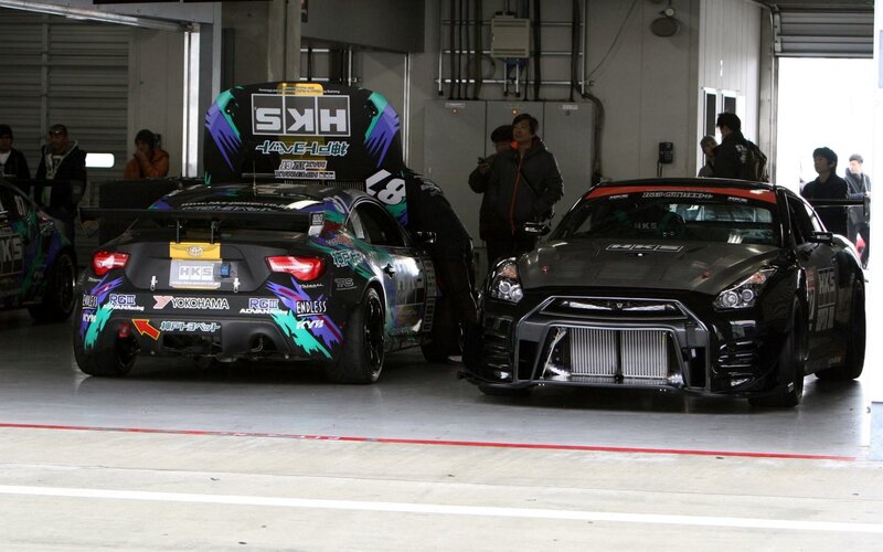 Two Race Cars in Garage — Black
