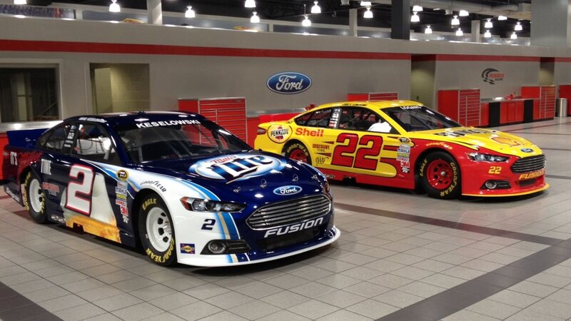Two Race Cars in Garage