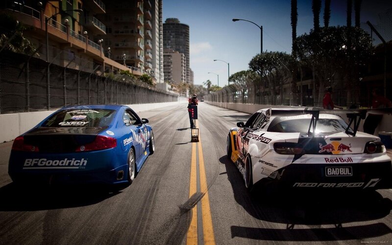 Two Race Cars on Track — Blue, Dramatic, Afternoon