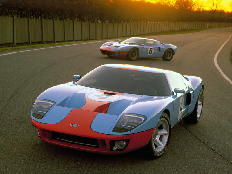 Two Race Cars on Track — Blue, Dramatic, Sunset