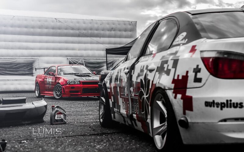 Two Race Cars on Track — Red, Dramatic