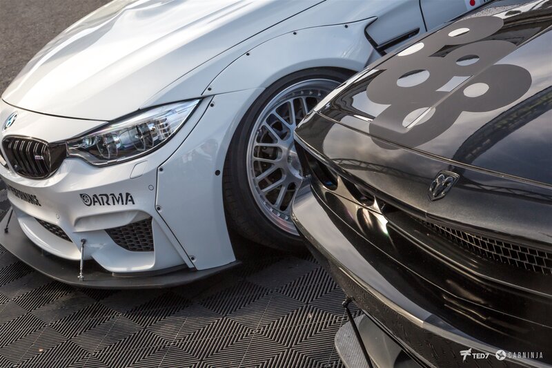 Two Race Cars Side by Side — White