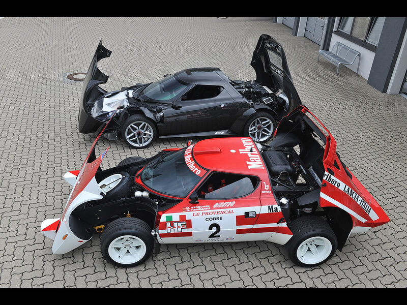 Two race cars with open doors