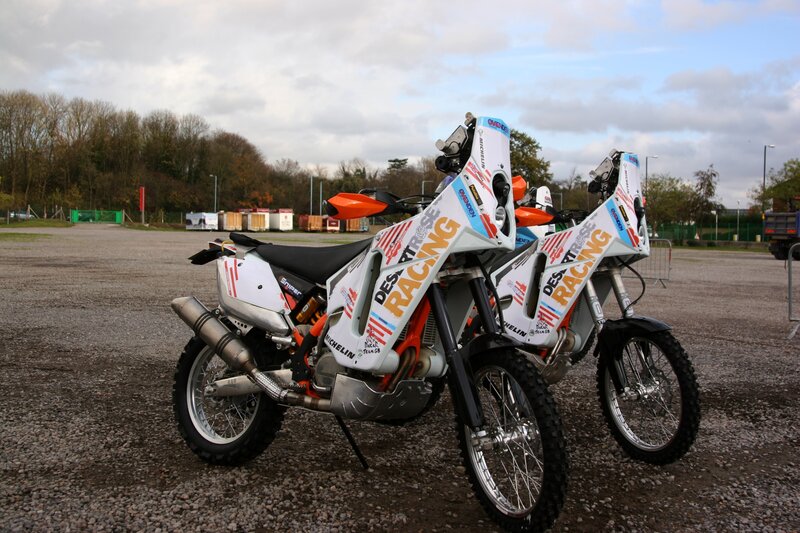 Two Racing Motorcycles — White