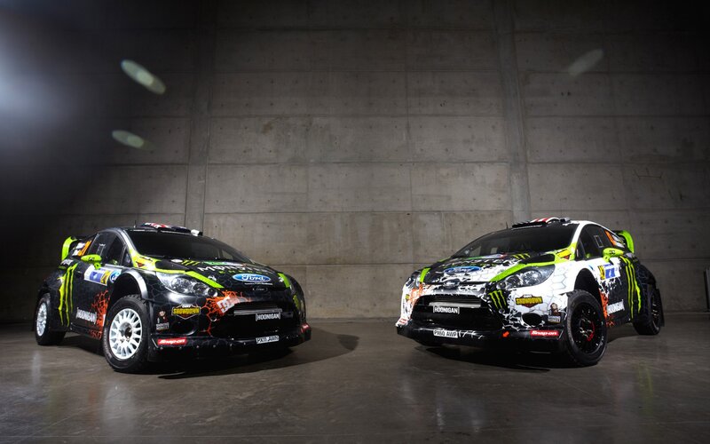 Two rally cars in a garage