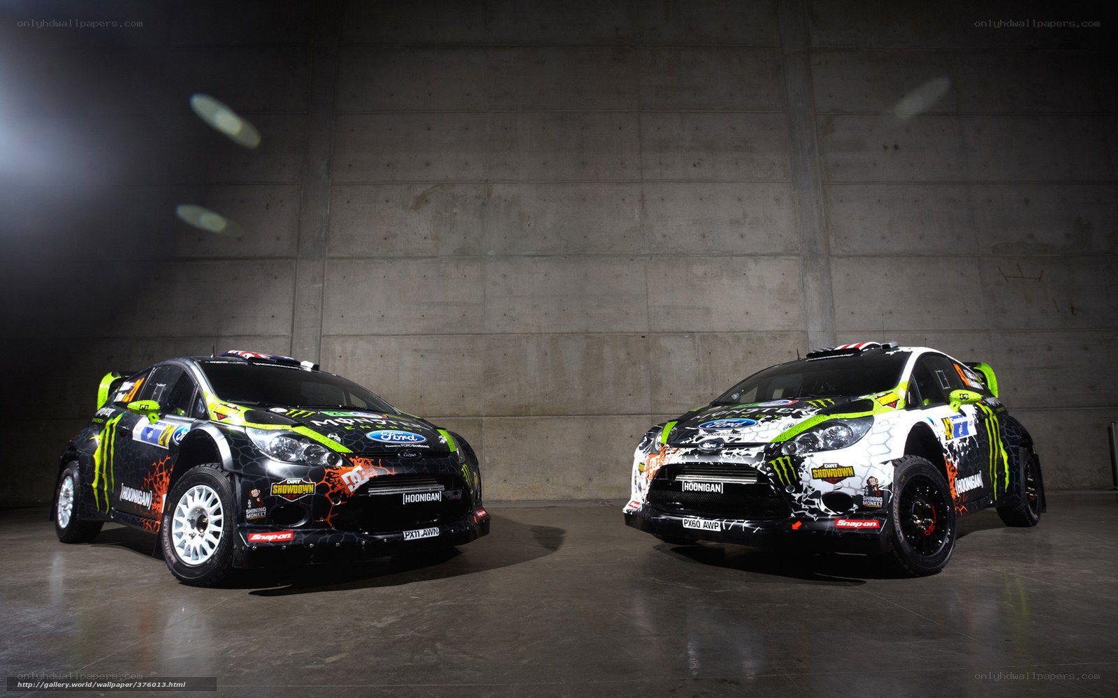Two rally cars in a garage