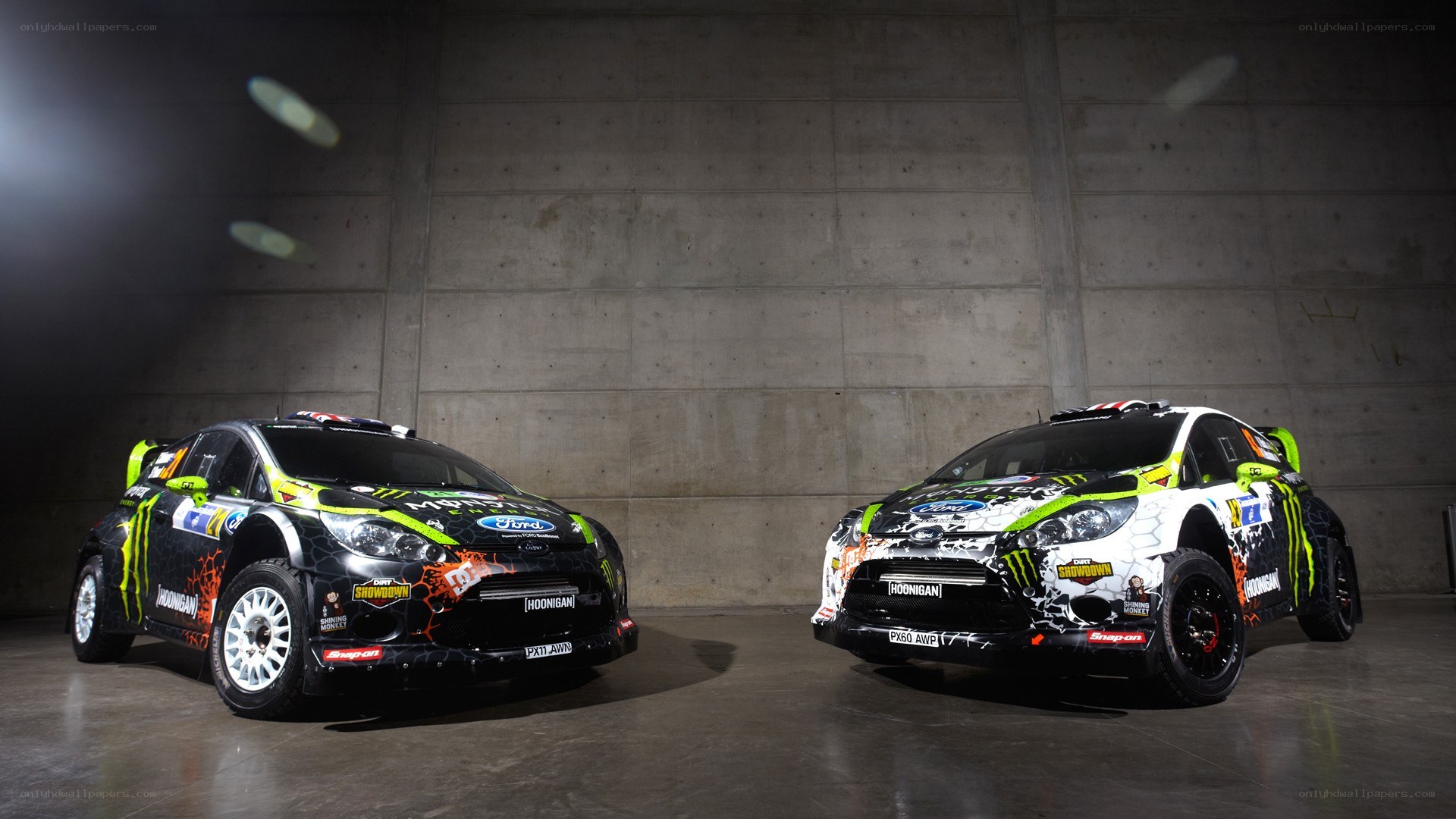 Two rally cars in a studio