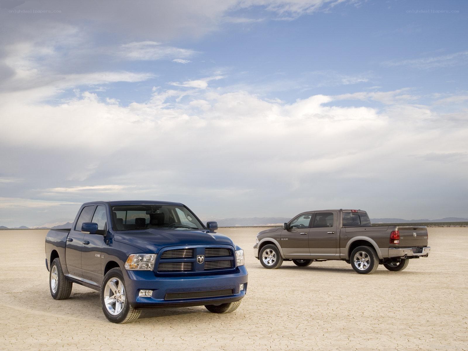 Two Ram pickup trucks in desert