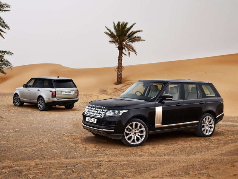 Two Range Rover SUVs — Black, Serene, Photograph