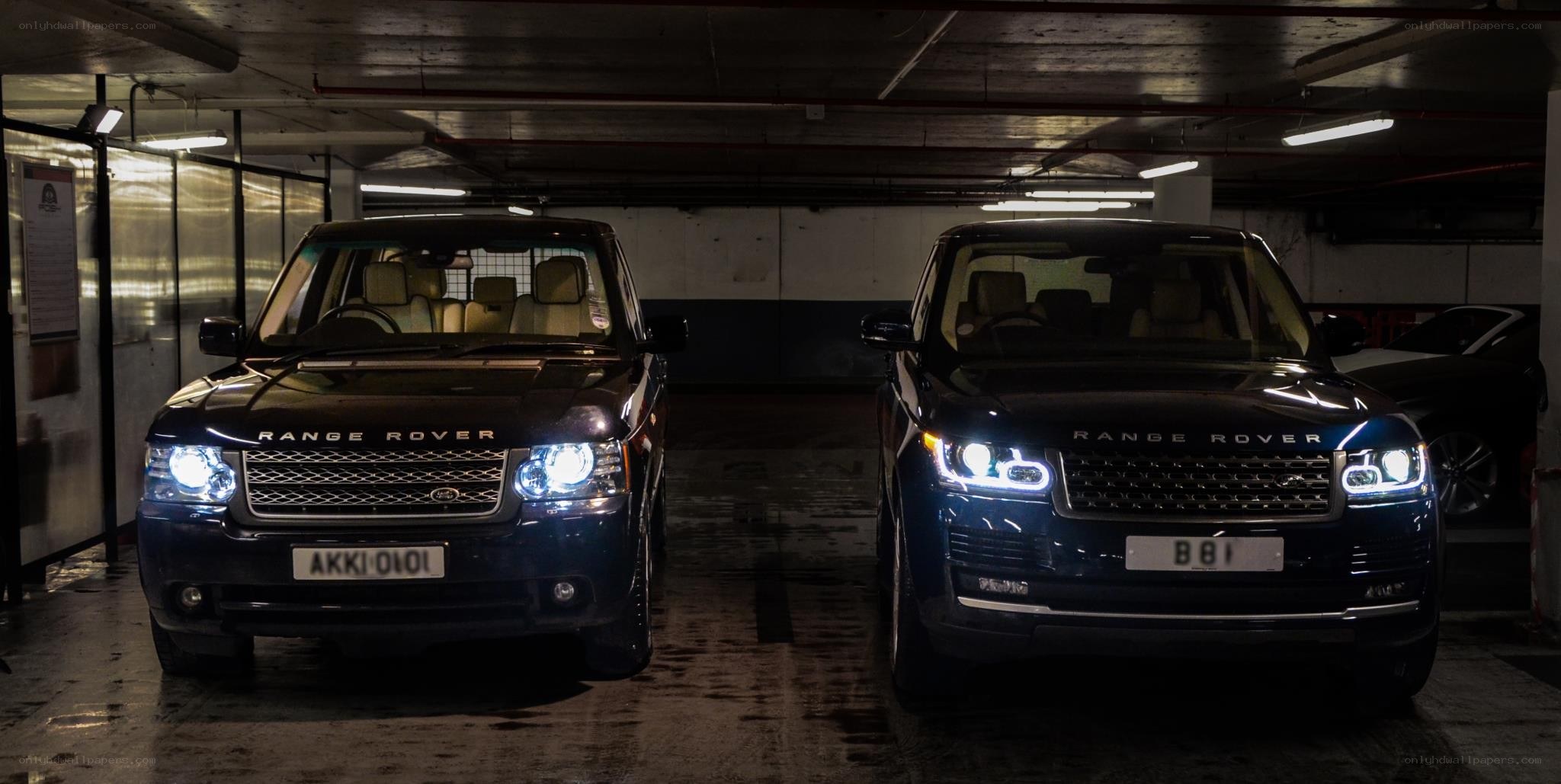 Two Range Rovers in parking garage