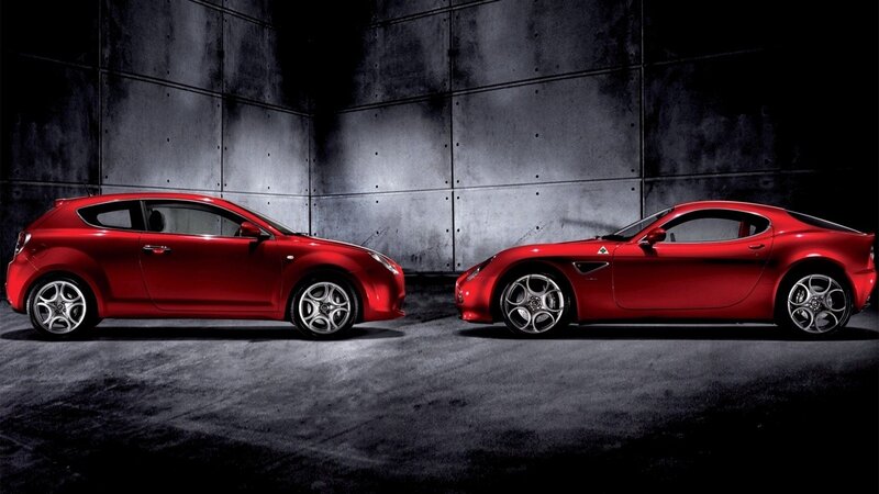Two red Alfa Romeo cars