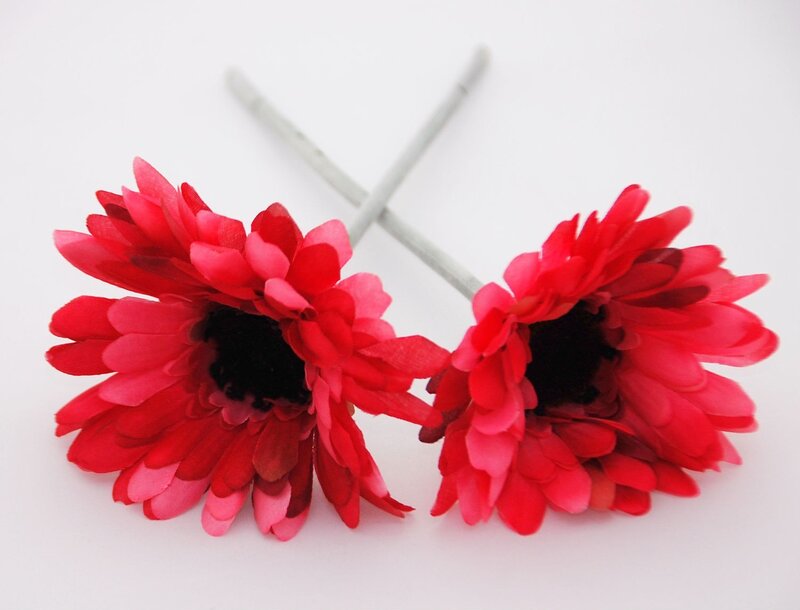 Two Red Artificial Flowers