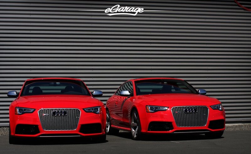 Two red Audi cars side by side