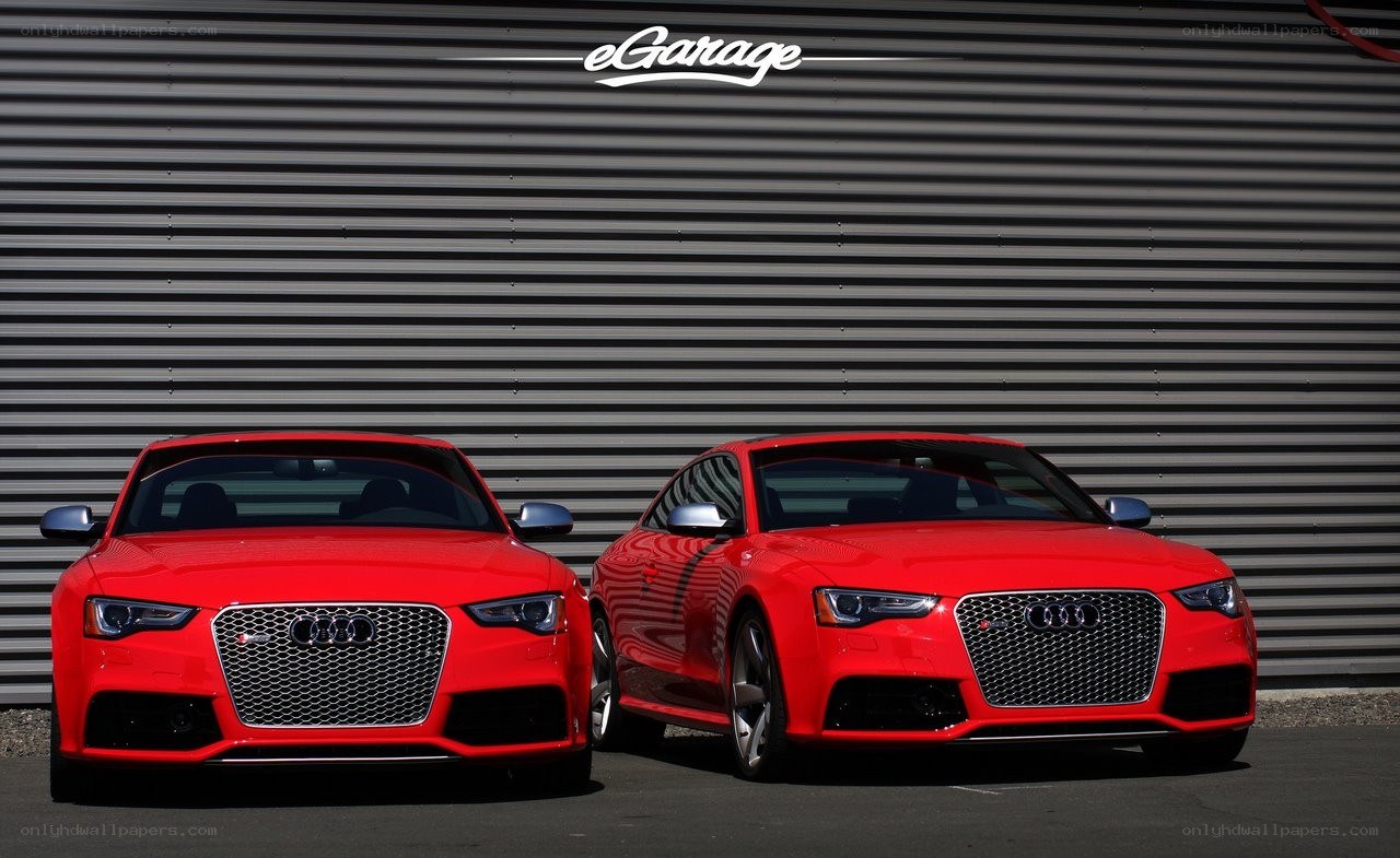 Two red Audi cars side by side