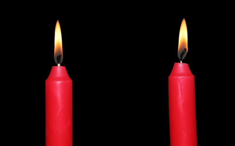 Two red candles burning