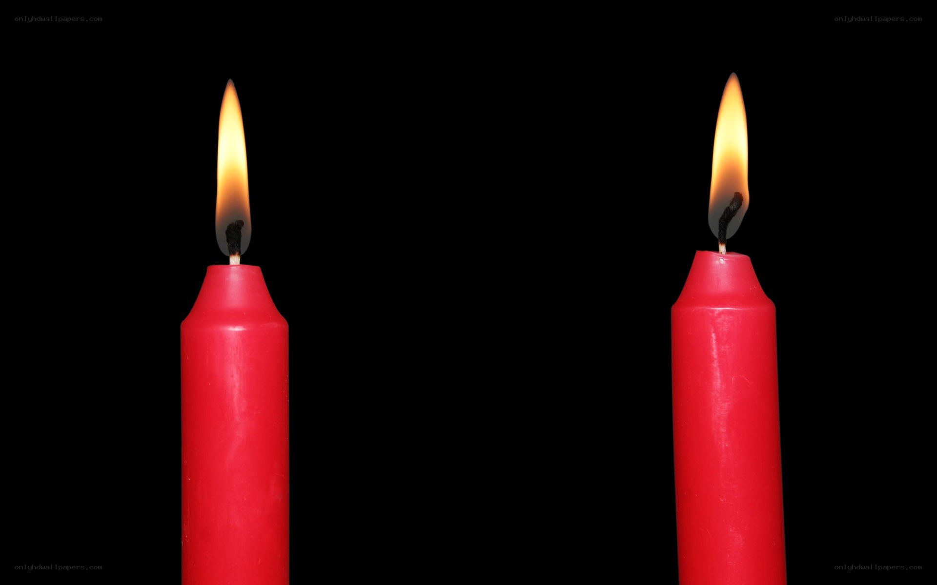 Two red candles burning