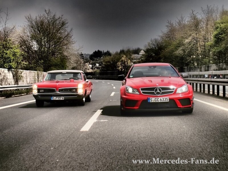 Two Red Cars on Road