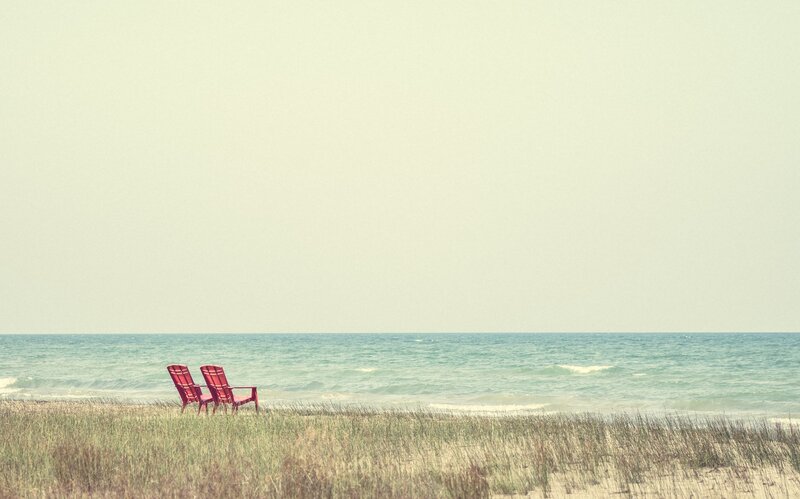 Two Red Chairs on Beach