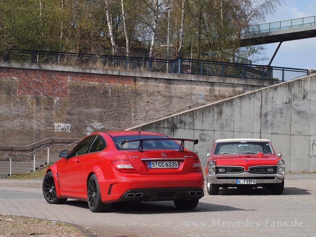 Two red classic cars