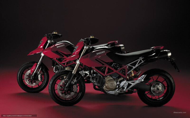 Two red Ducati motorcycles