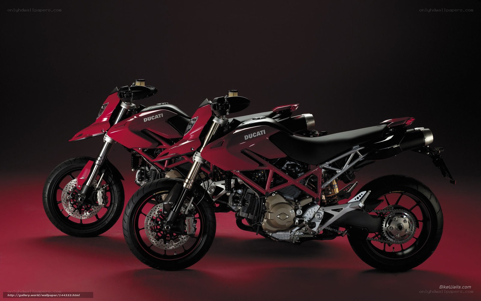 Two red Ducati motorcycles
