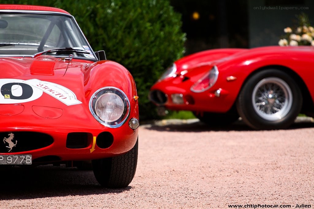Two red Ferrari race cars