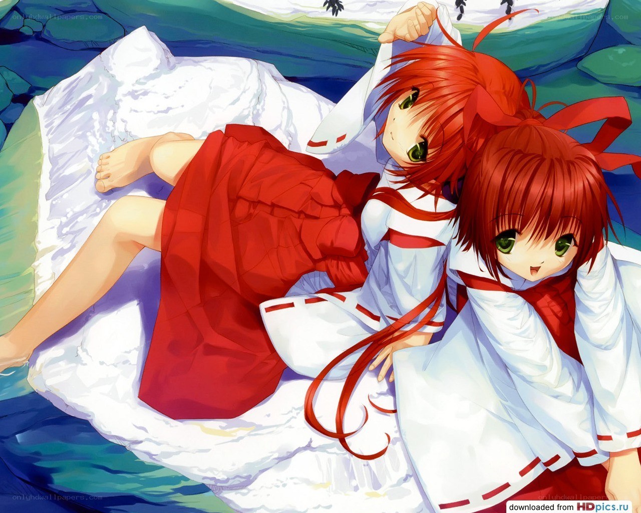 Two red-haired girls on a rock