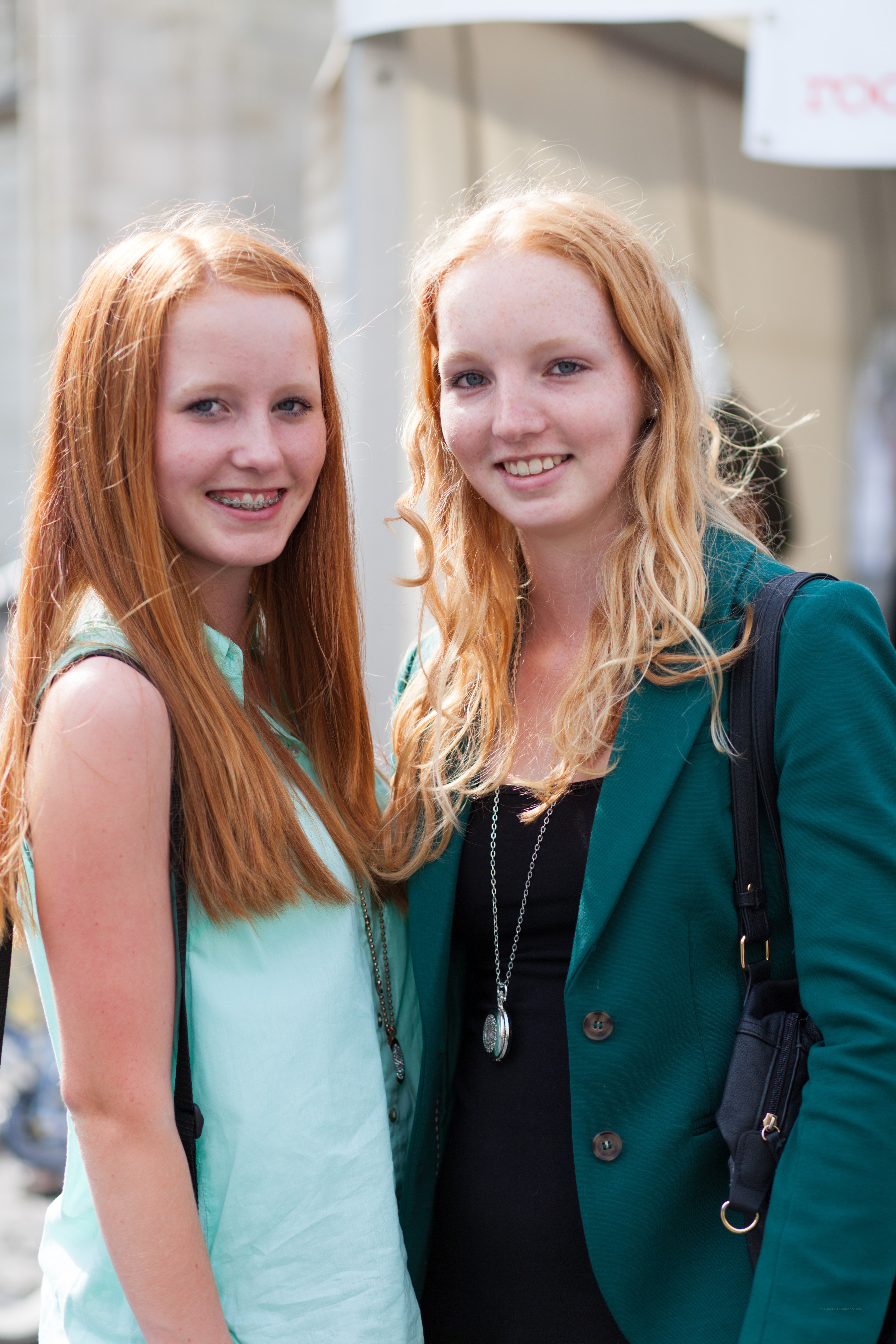 two red-haired girls smiling