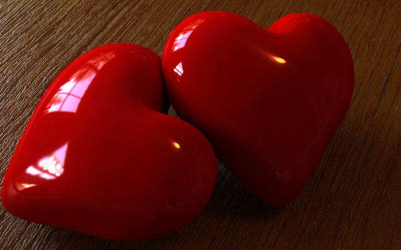 Two red hearts on wood