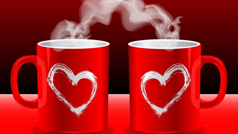 two red mugs with hearts