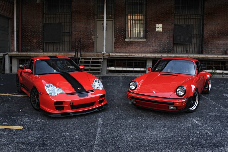 Two red Porsches parked