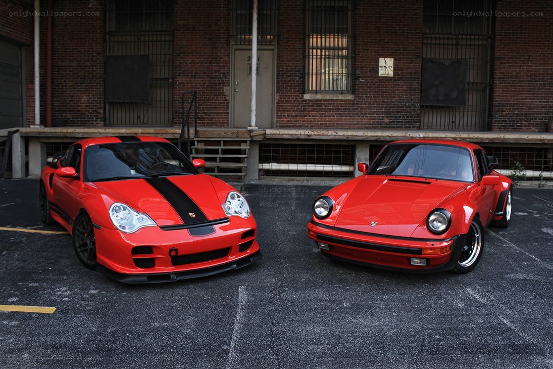 Two red Porsches parked