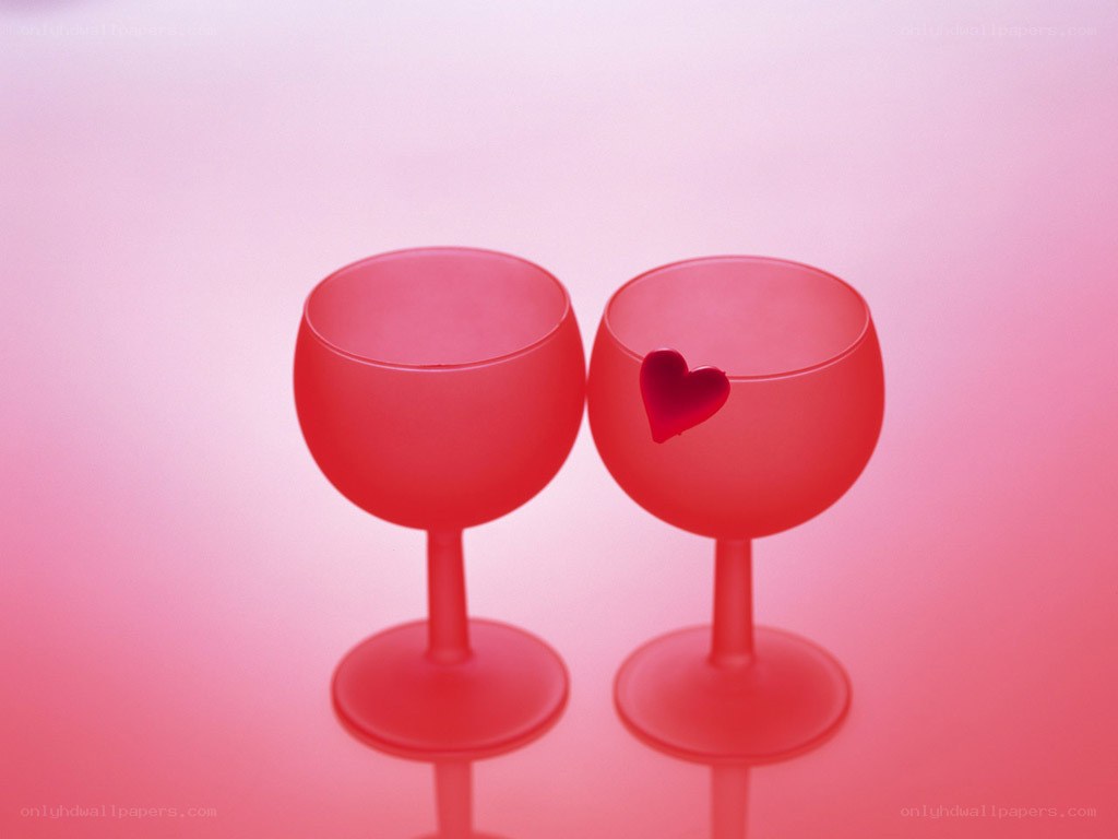Two red wine glasses with heart