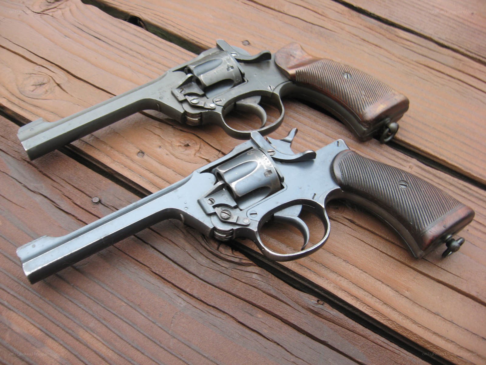 Two revolvers on wood