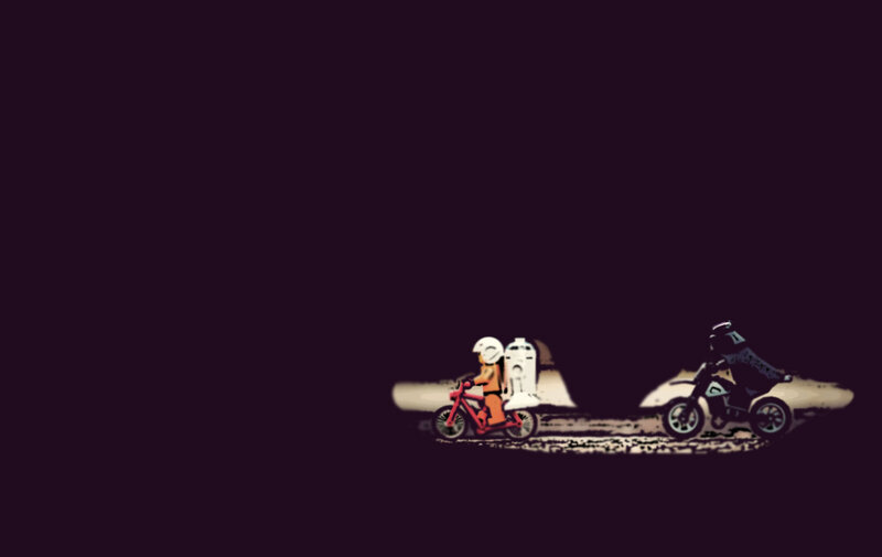 Two riders on bikes at night