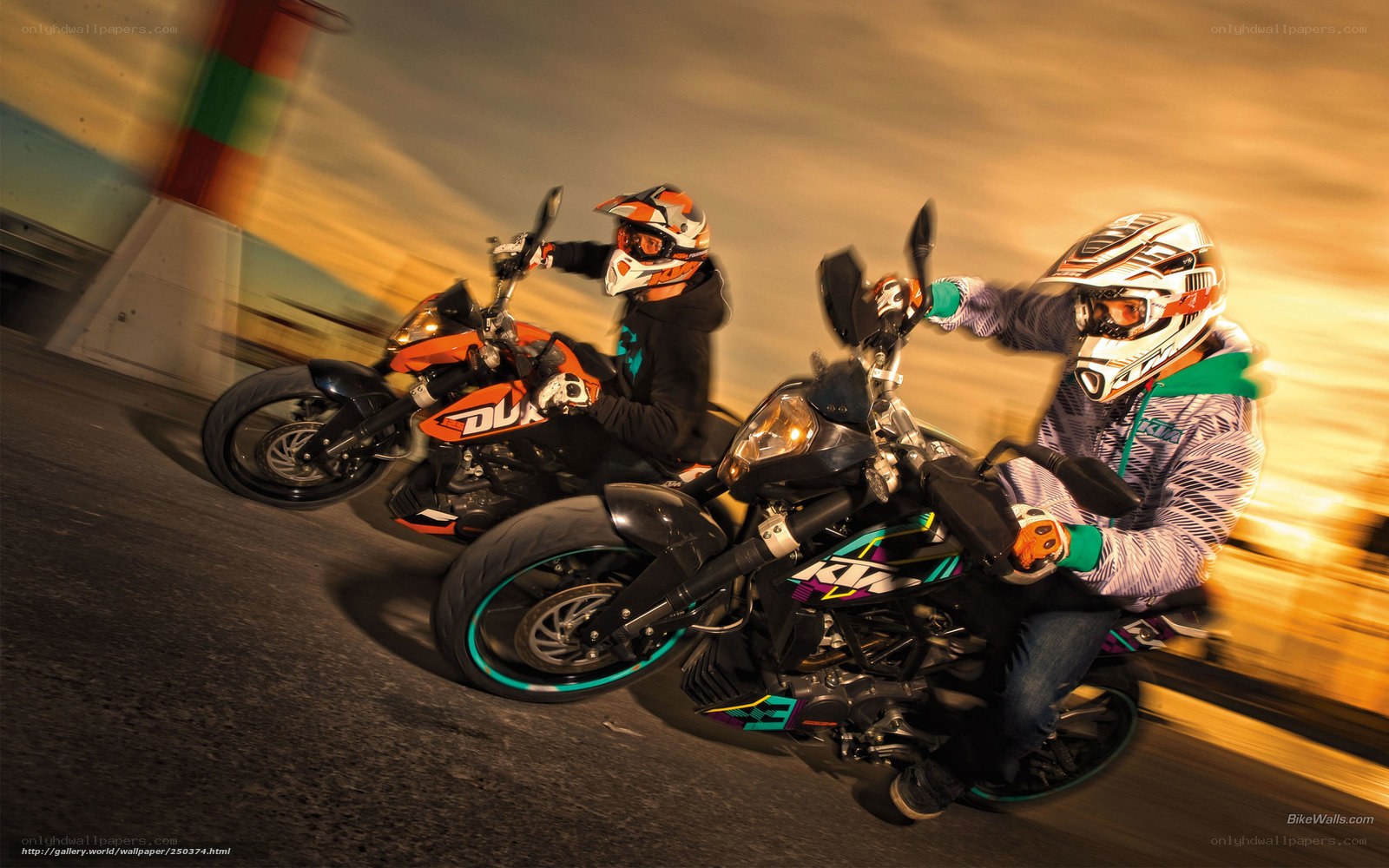 Two riders on KTM motorcycles