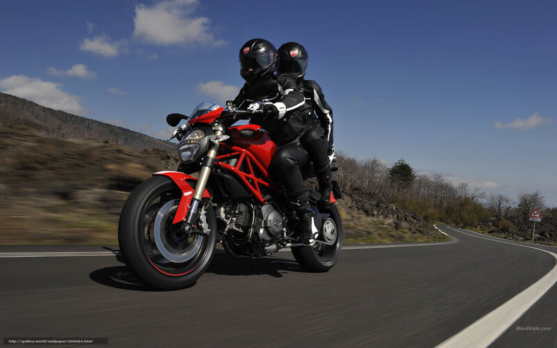 Two Riders on Red Motorcycle — Dynamic