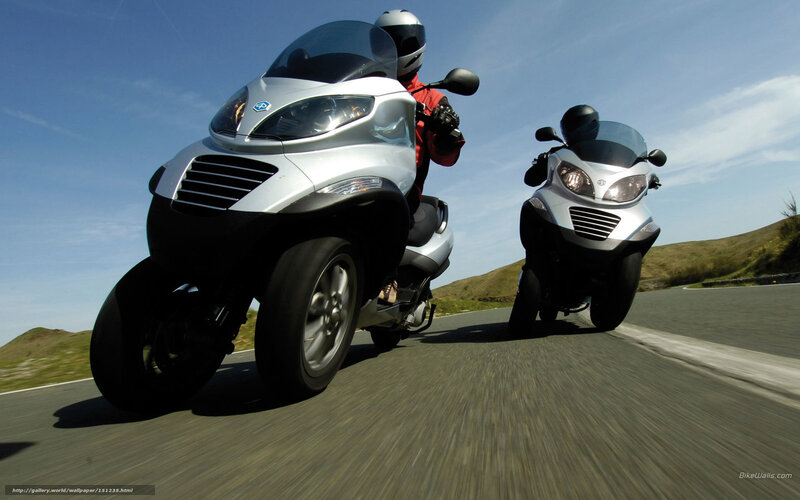 Two riders on silver trikes