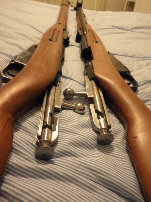 Two rifles on a bed