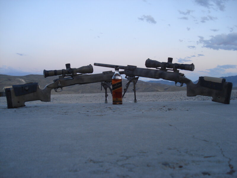Two rifles with a bottle