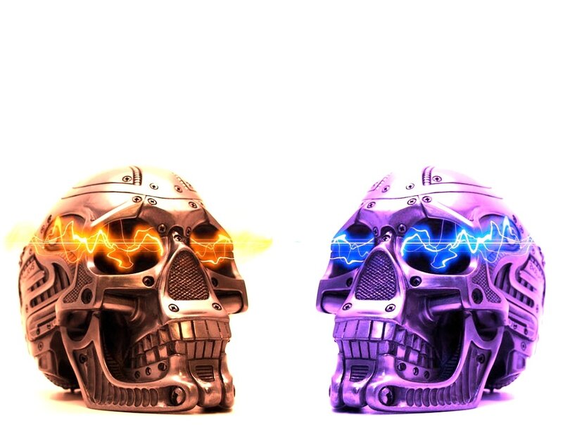two robotic skulls with energy