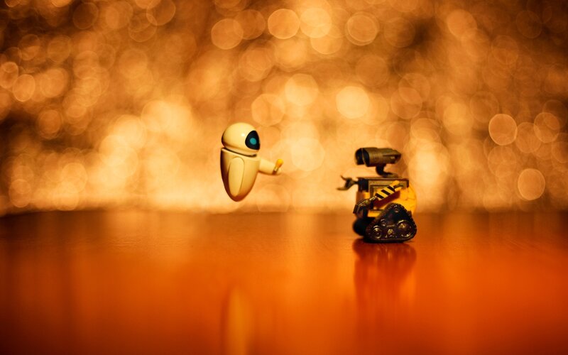 Two Robots Facing Each Other — Orange
