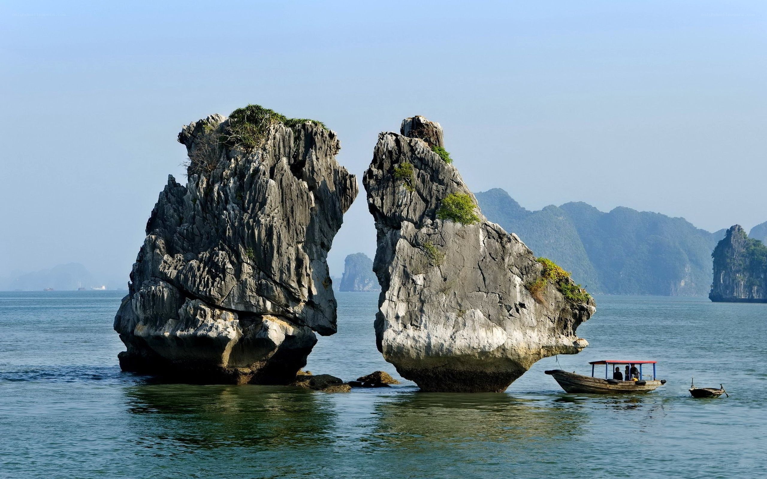 Two rock formations in a bay