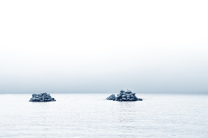 Two Rock Piles in Water