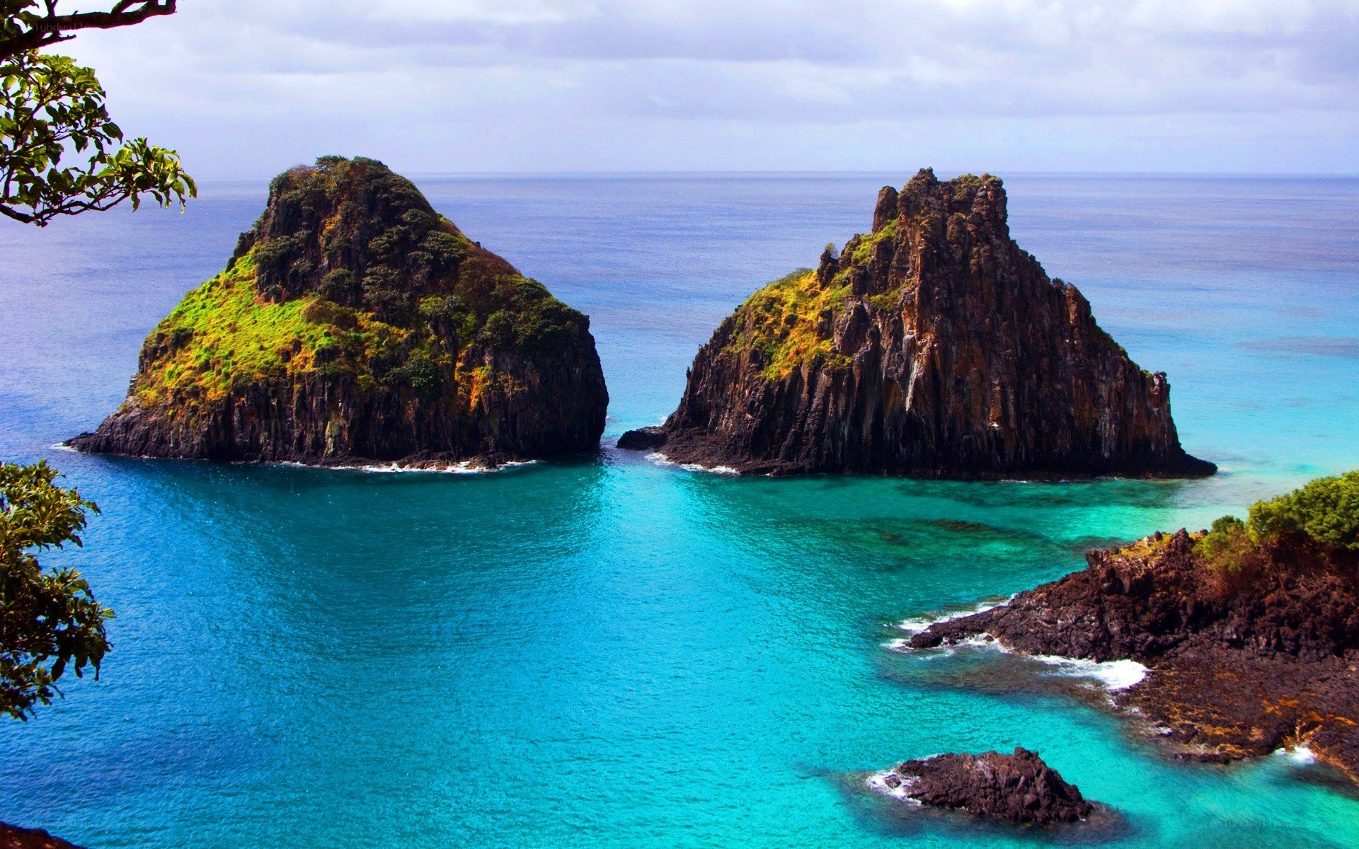 Two rocky islets in turquoise water