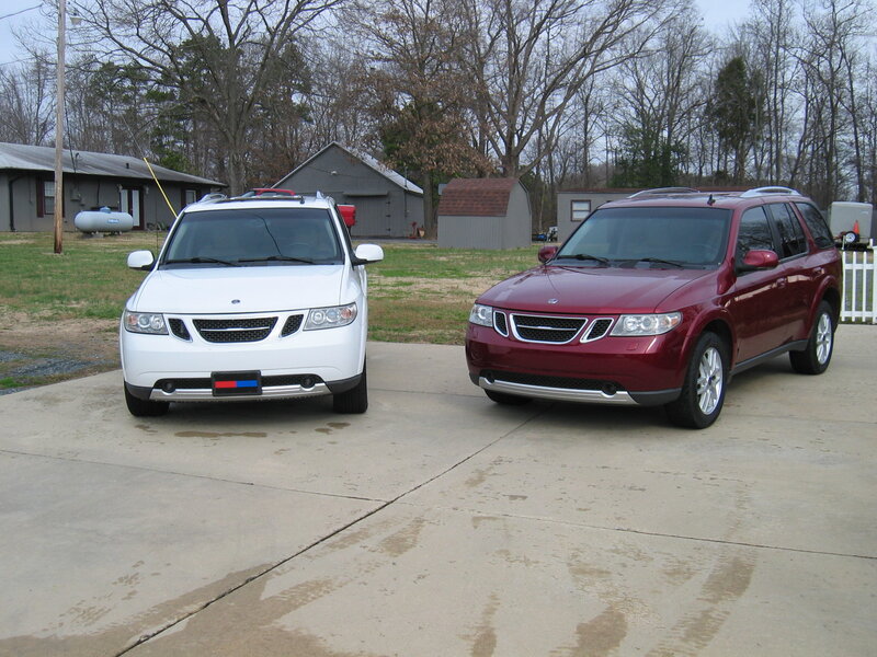 Two Saab SUVs on a driveway