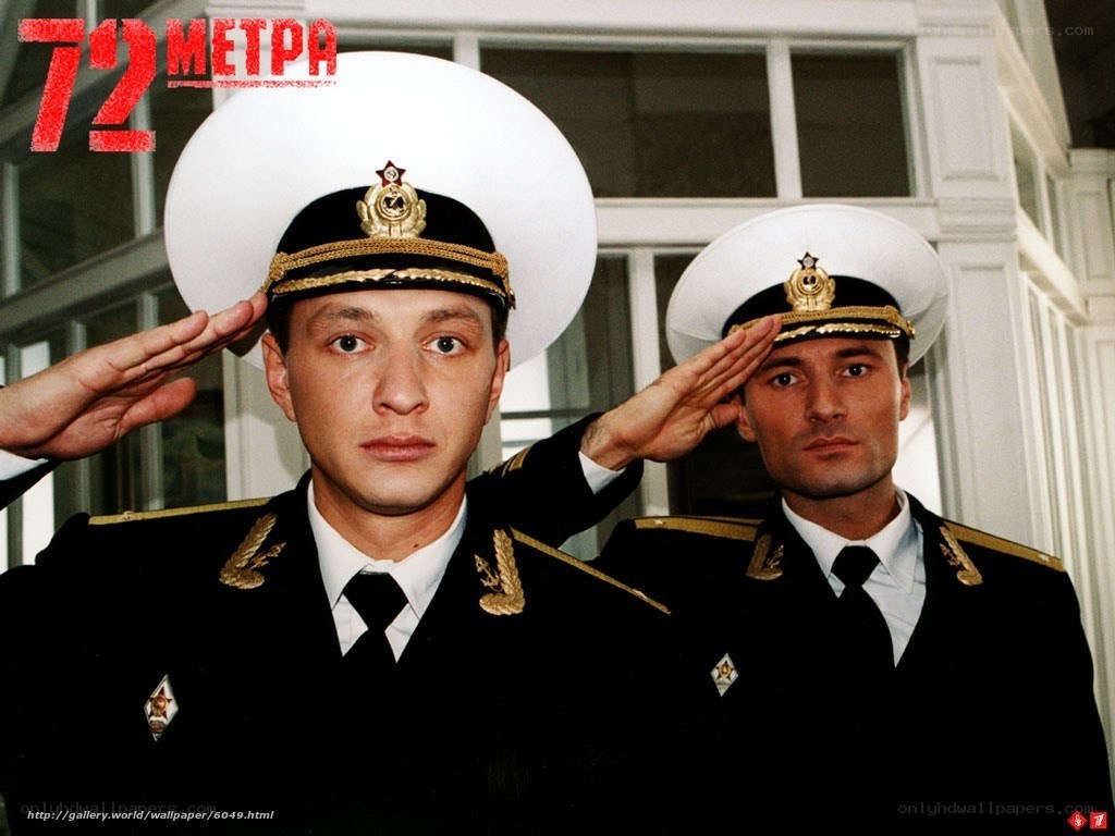 Two sailors in uniform saluting