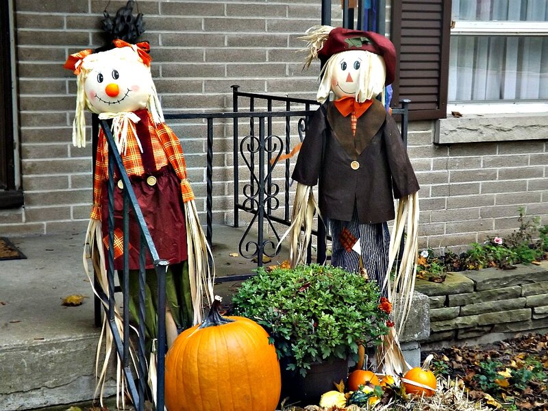 Two Scarecrows on Porch