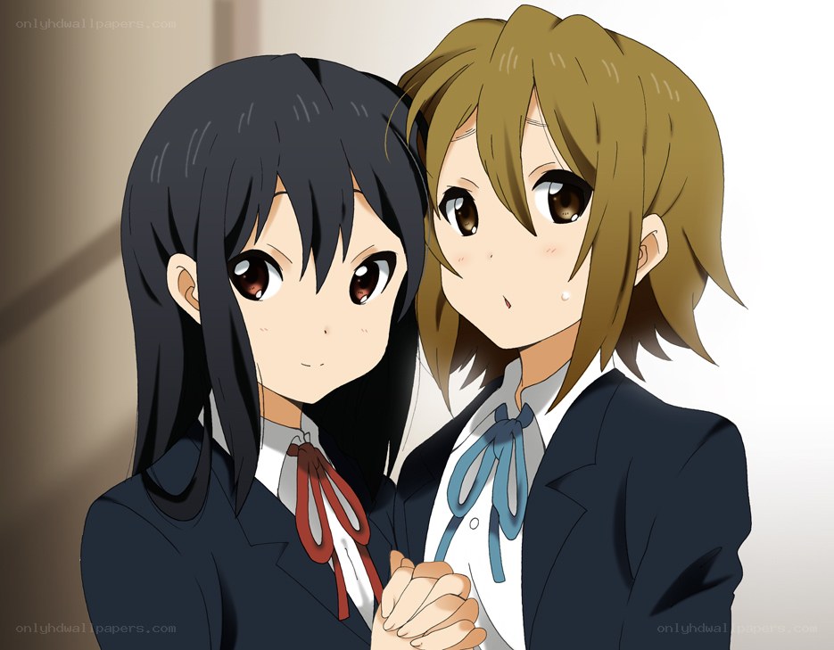 Two schoolgirls holding hands